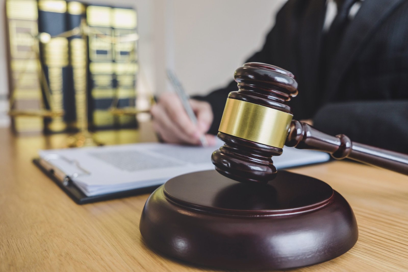 Judge gavel with scales of justice, professional male lawyers or Judge gavel with scales of justice, professional male lawyers or counselor working having at law firm in office. Concepts of law.